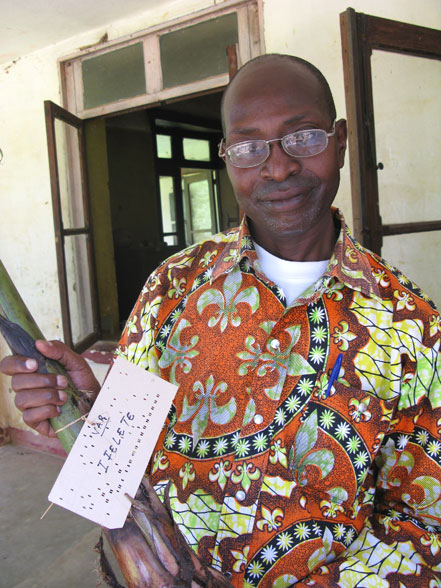 Benoît Dhed'a Djailo holding a Plantain from Yangambi (Photo by Dan Koeppel).